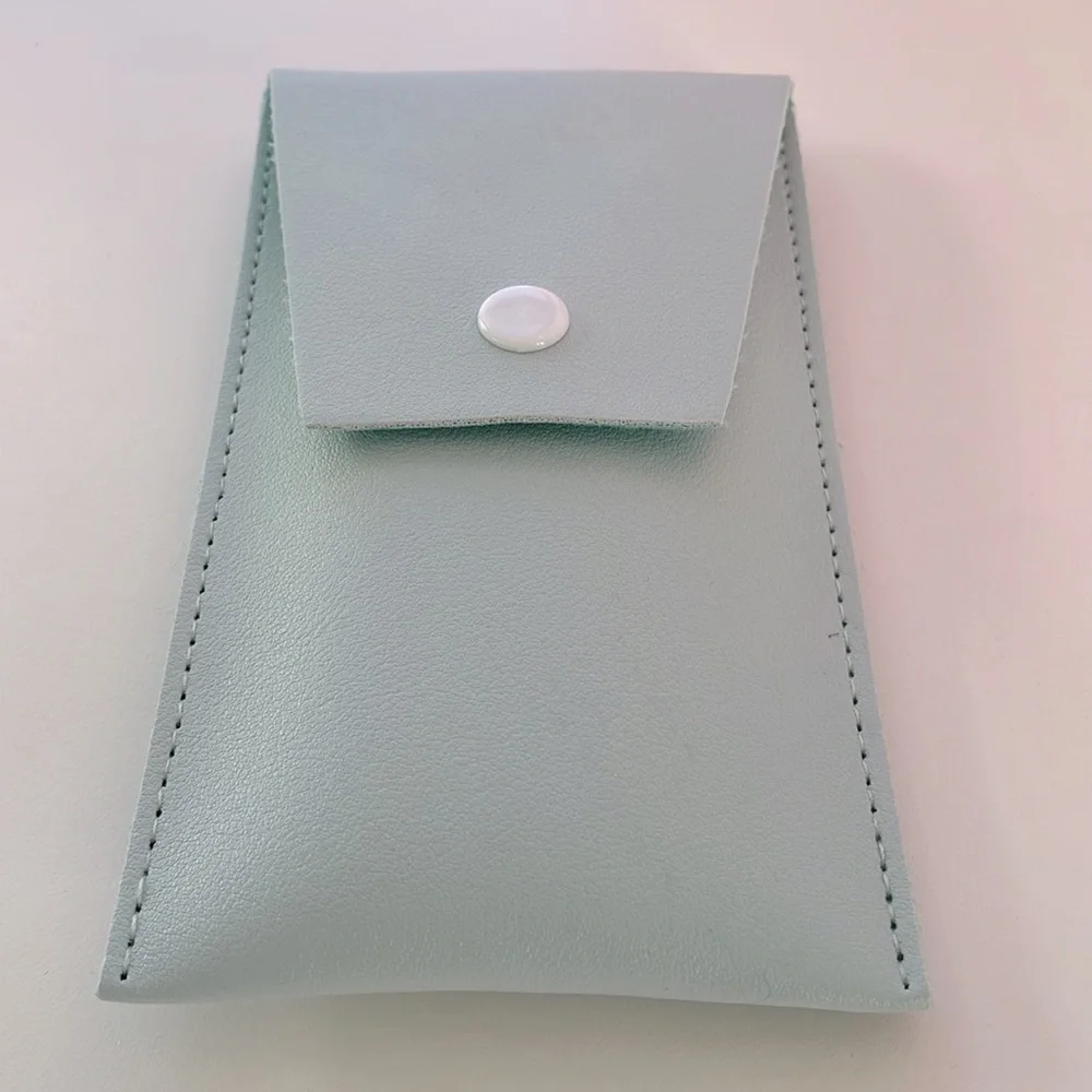 Set of travel size makeup brushes in ice blue travel envelope. New.